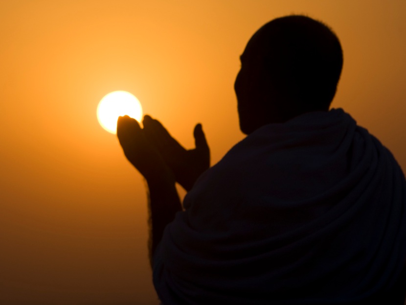 A Muslim pilgrim prays at the top of Mount Noor in Mecca